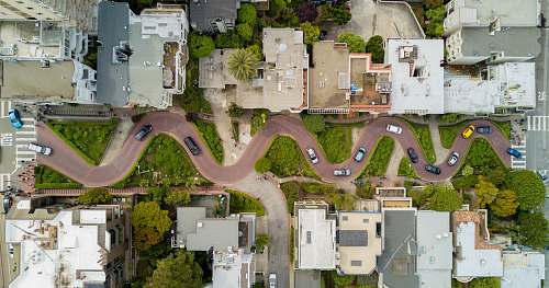 lombard street aerial photography of gray concrete houses and brown road aerial view